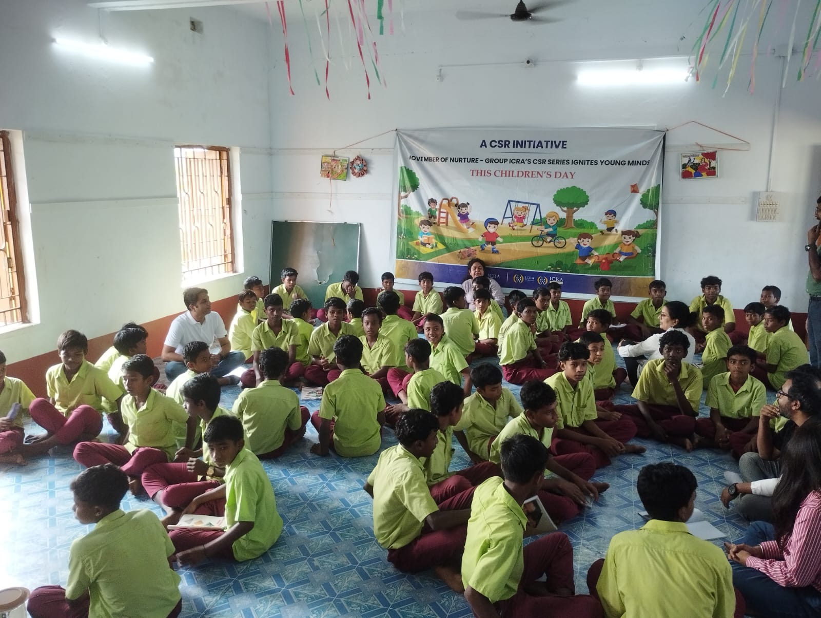Students seated together at a Children's Day session held under Group ICRA's CSR series