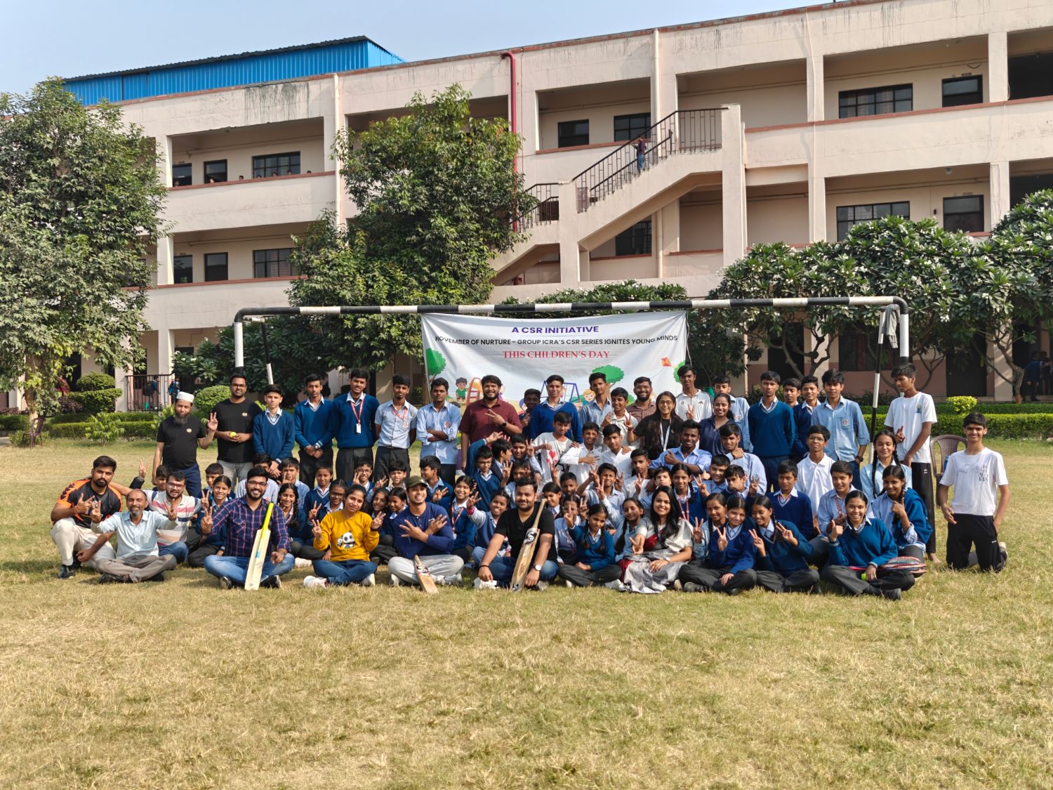Students and volunteers after a Children's Day sports session on the school ground