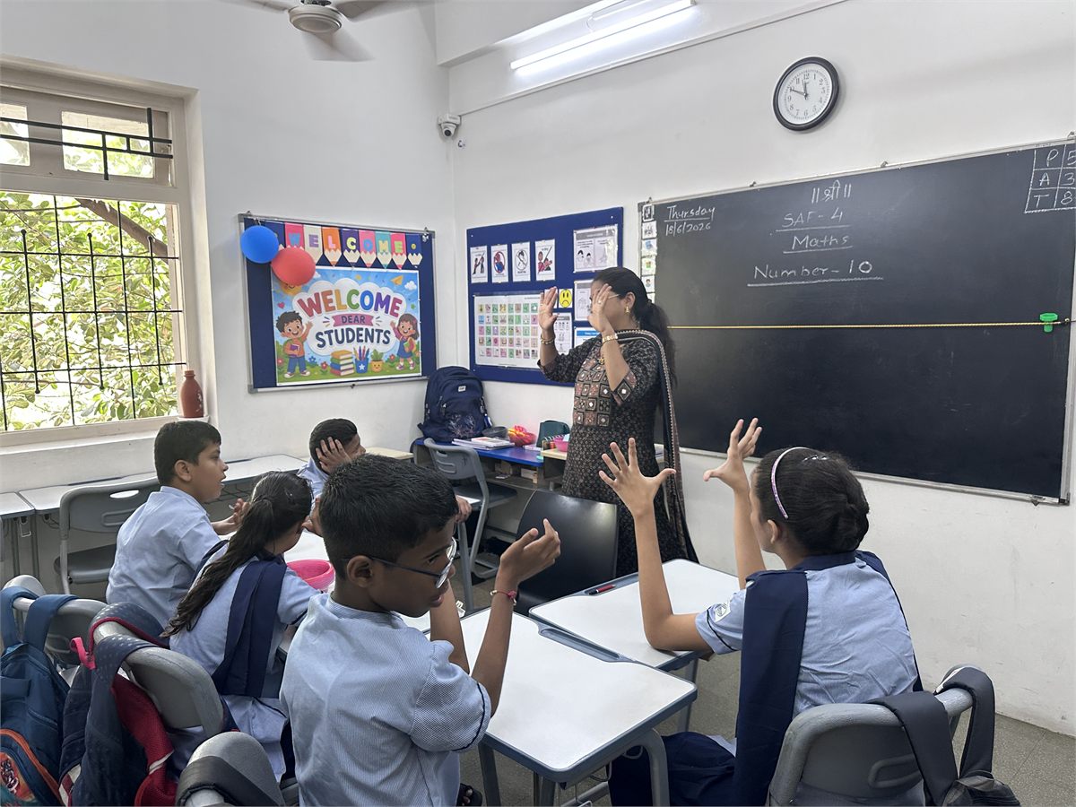 Teacher leading a maths lesson at a special school
